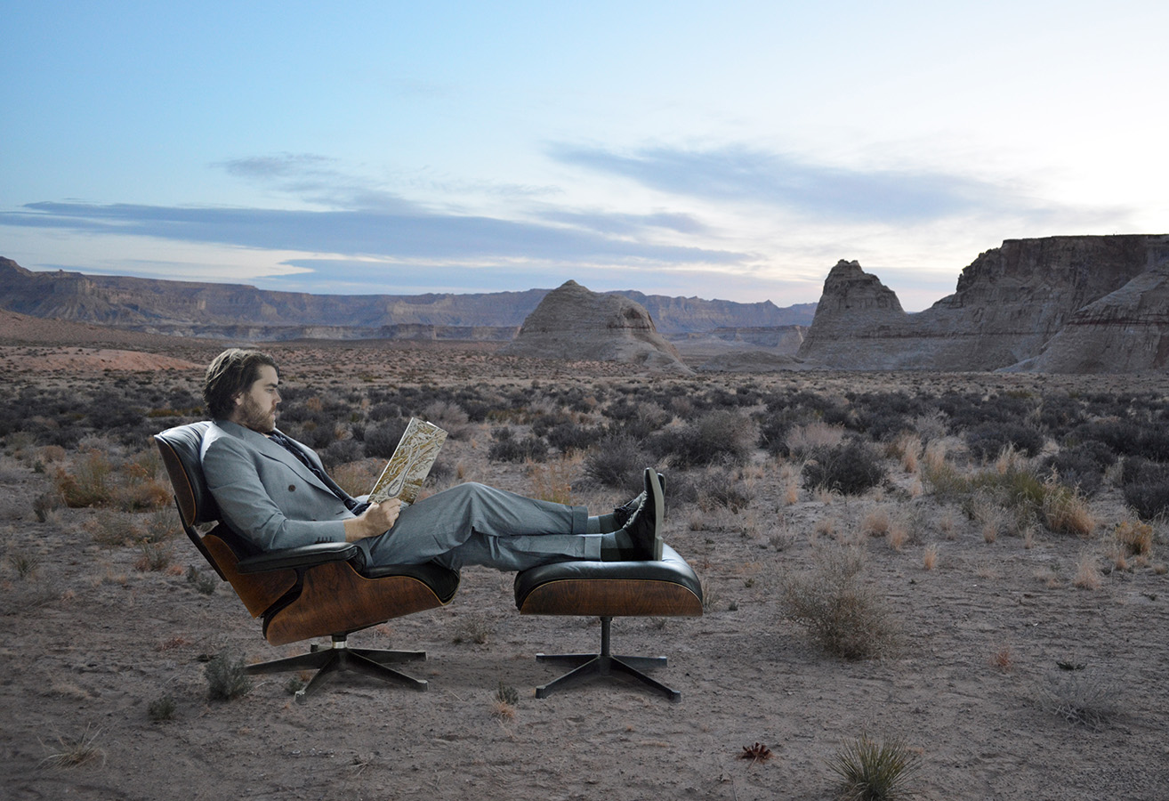Vitra Eames Lounge Chair in an outdoor desert setting with a seated user